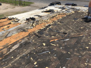Residential home with visible roof damage from a Texas storm