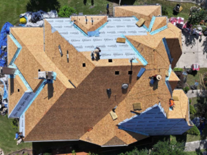 an aerial view of a roof being repaired by AMC Roofing