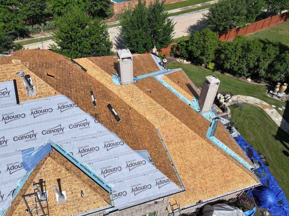 a bare roof being repaired